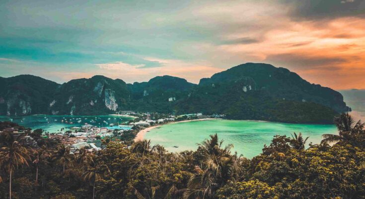 Aerial view of Phi Phi Island twin bays and limestone cliffs in Thailand during sunset