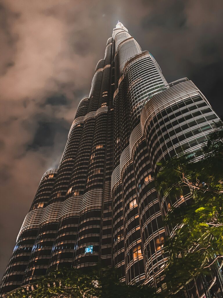 Burj Khalifa high-rise building view from below at night in Dubai