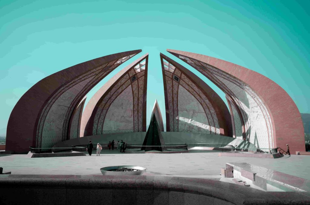 Wide angle shot of the Pakistan Monument under a vibrant teal sky at Shakarparian Hills Islamabad.