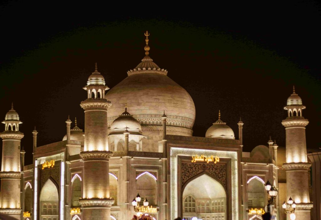 Beautiful golden Taj Mahal inspired pavilion lit up at night at Global Village Dubai — GlanceAsia