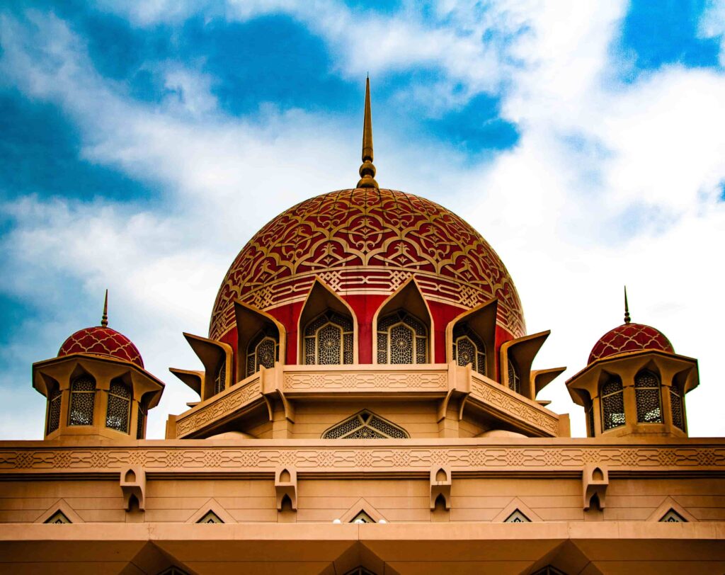 Close-up of Putra Mosque's ornate red and gold dome